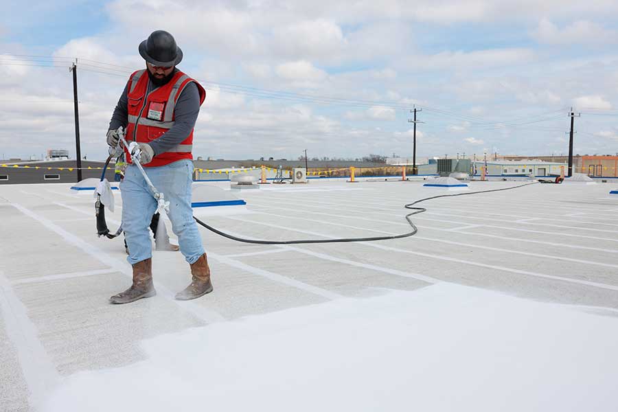 Benefits of Opting for a Liquid-Applied Roof Coating Over a Complete Tear-off